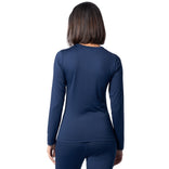 Person wearing a navy long-sleeve top and pants on a white background