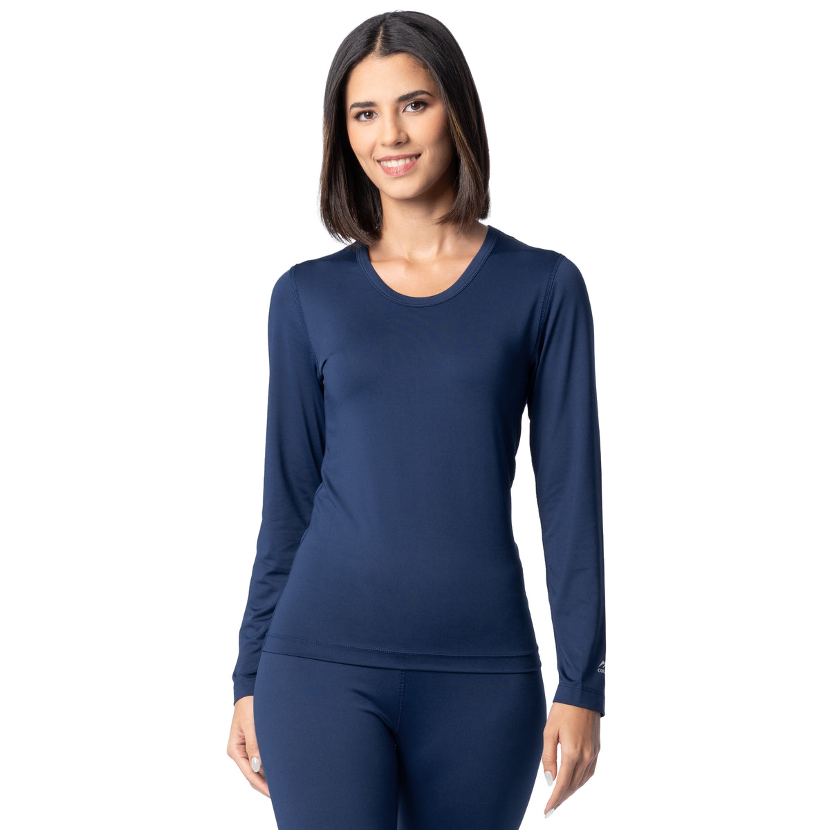 Woman wearing a navy long-sleeve top and leggings on a white background