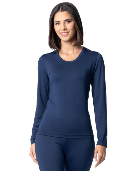 Woman wearing a navy long-sleeve top and leggings on a white background