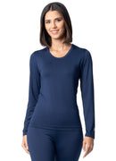 Woman wearing a navy long-sleeve top and leggings on a white background