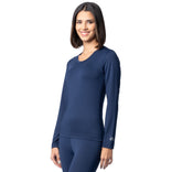 Woman wearing a navy blue long-sleeve athletic top on a white background