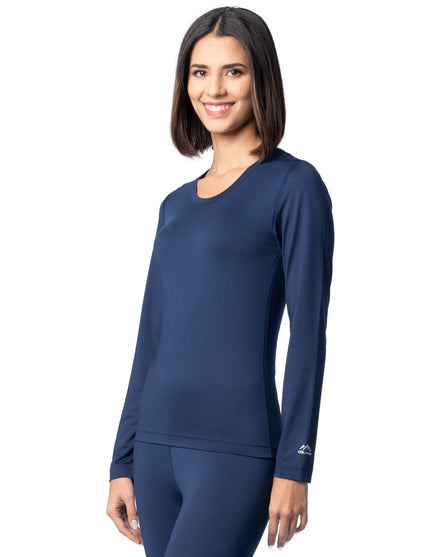 Woman wearing a navy blue long-sleeve athletic top on a white background