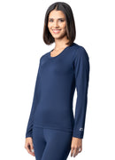 Woman wearing a navy blue long-sleeve athletic top on a white background