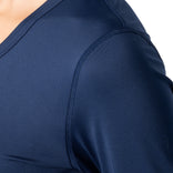 Close-up of a navy blue athletic shirt with a white background